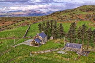 Whether you use it as a base camp to wild swim in Snowdonia or beach hop in Anglesey this 19thcentury farmhouse is as...